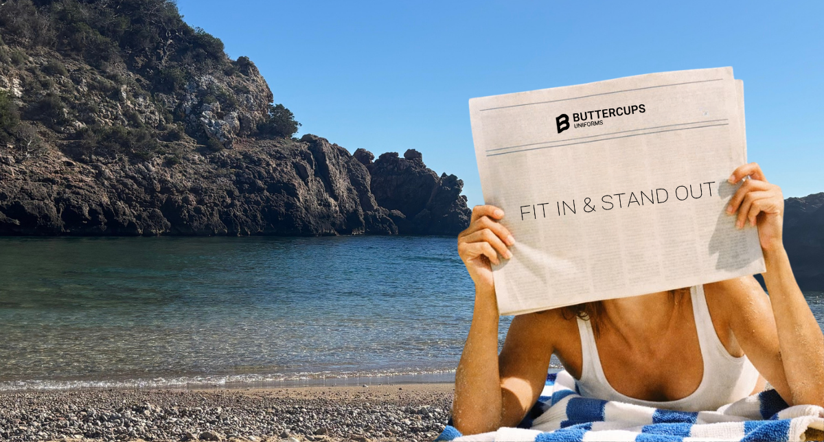 Lady at the beach reading newspaper in the sun