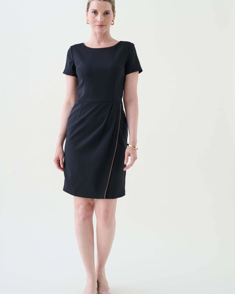 Woman wearing a black dress on a white background from the hospitality and corporate collection